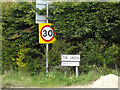 TM1853 : Roadsign & The Green sign by Geographer