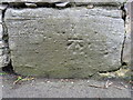 Bench mark on a wall junction in Castle Lane