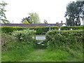 Public footpath reaches Cuckfield Lane from the north