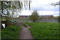 The Sowe Valley footpath nears a footbridge in sight of Caludon Castle School, Coventry