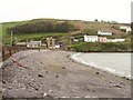 W2131 : Beach and sea wall at Squince Harbour by Gordon Hatton