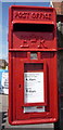 Close up, Elizabeth II postbox outside convenience store on Cromer Road