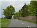 Stone wall and Camp Wood by Fosse Way