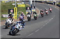 Number 4, Hutchinson leads the field into York Corner at Portstewart