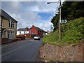 Road through Halberton and Public Footpath sign