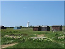 SY6868 : Beach Huts and Old Lighthouse, Portland by Becky Williamson