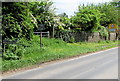 SO5734 : Fownhope boundary sign and speed limit sign by Jaggery