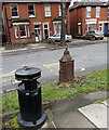 Litter bin and a metal stump, Gloucester Road, Cheltenham