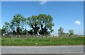 Ranch-type fencing along the north side of the A28