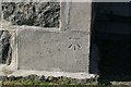 Cut benchmark on St Barr Church, Northbay, Barra