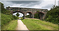 An impressive bridge carrying a footpath over the Cheshire Lines Path