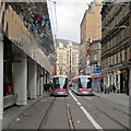SP0686 : Two trams in Stephenson Street by John Sutton