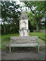 NU0526 : Fountain and bench, Chillingham by JThomas