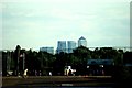 TQ4590 : View of Canary Wharf from the side of the lake in Fairlop Waters by Robert Lamb