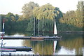 View of boats reflected in the lake in Fairlop Waters