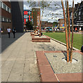 Walking and sitting in remodelled Trinity Street, Coventry