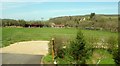 Field and barns by the A38