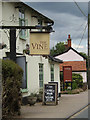 TL9979 : The Vine Inn Public House sign by Geographer