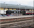 Steam locomotive behind Gloucester railway station