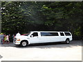 Limo for the bridesmaids outside St Mary, Harefield