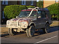 TQ3095 : Heavily mud-spattered Land Rover Discovery, Winchmore Hill by Paul Bryan