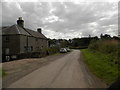 Minor road passing off-road driving centre at Glentarkie