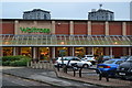 Supermarket on Sheffield ring road, with residential towers beyond