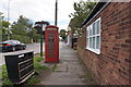 Red BT telephone kiosk on Main Road, Thorngumbald