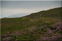 NN2851 : A runner among the walkers on the West Highland way south of Glencoe by Chris