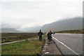 NN2653 : Wet hikers beside the A82 at Glencoe by Chris