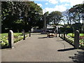 The war memorial and two dog lovers in Formby