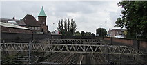 SJ8989 : Railway between a footbridge and a road bridge, Stockport by Jaggery