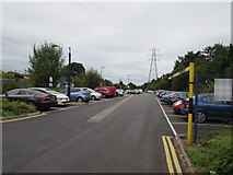SP0482 : Towards an electricity pylon in Selly Oak railway station car park by Jaggery