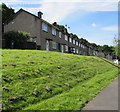 Row of houses on a bank above Graig Wood Close, Malpas, Newport