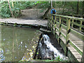 SE2738 : Footbridge over mill dam on the Meanwood Beck by Stephen Craven