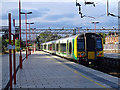 A class 350 electric train departing from Stafford