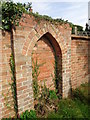 Bricked up gateway from footpath