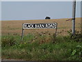 TM1389 : Black Barn Road sign by Geographer