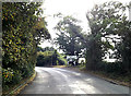 TM1887 : B1134 Station Road & Roadsign by Geographer