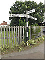 TM1686 : Signpost & School Road sign on School Road by Geographer