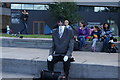 View of a "headless man in a suit" street entertainer on South Bank