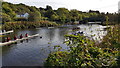 Boats waiting for the Long Distance Sculls race below Sheepwash Bridge on the River Wansbeck