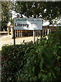 TM0495 : Attleborough Public Library sign by Geographer