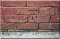 Benchmark on abutment wall of railway bridge, Parkside