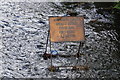 Road sign in the River Holme