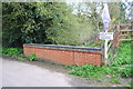 Parapet of bridge taking The Nook over a stream