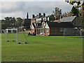 The Groundsman at work at Gonville and Caius Sports Ground