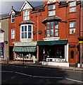 Walkers and Flame Lily in High Street, Tywyn