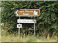 TL9219 : Roundbush Road sign & roadsign by Geographer