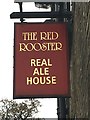 The sign of The Red Rooster